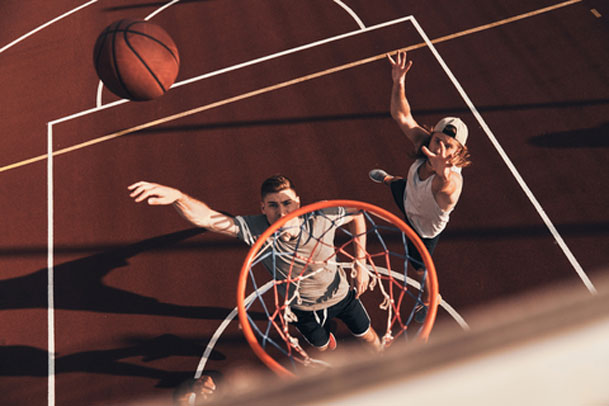 Young men playing basketball